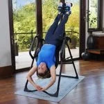 Teeter FitSpine FX-3 Premium Inversion Table with Program Mat and Comfort Cushion in use.