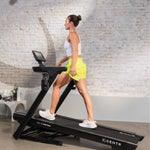 Centr Runr-S folding treadmill with 10” touchscreen in use.