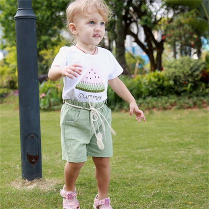 Younger Tree baby girl summer outfit with short sleeve t-shirt and green shorts for 6 year olds.